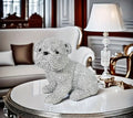 A Silvery Dot-Studded Bulldog Statue in a Sitting Position